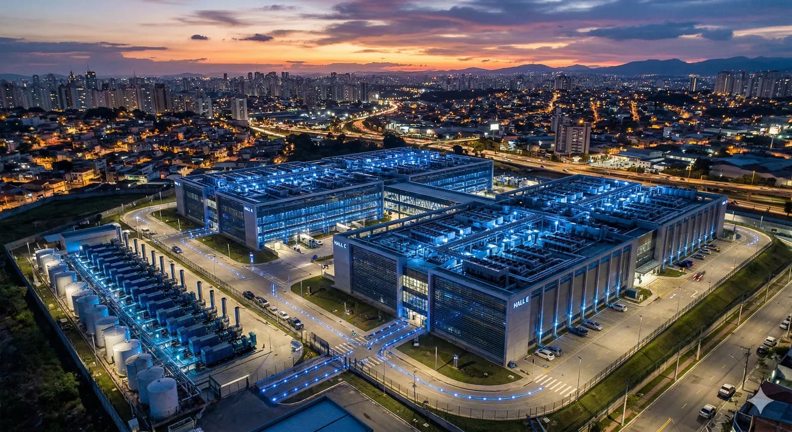 Data center campus with blue LED lighting at dusk in Latin America